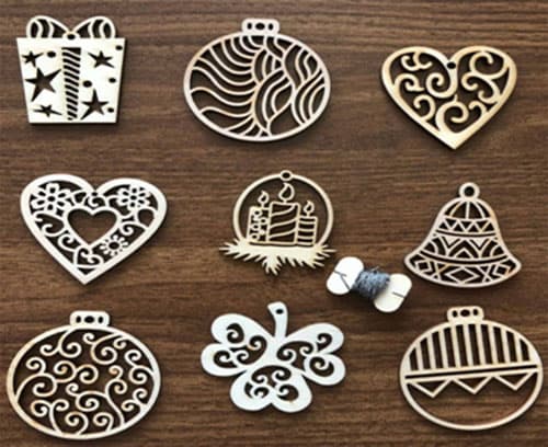 Novogodišnji drveni ukrasi 9 komada sR